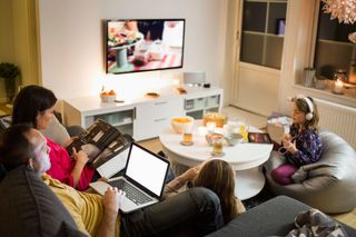 Family using multiple internet-connected devices