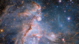 A gorgeous sparkling scene with pinkish red structures and a dark blue sky.