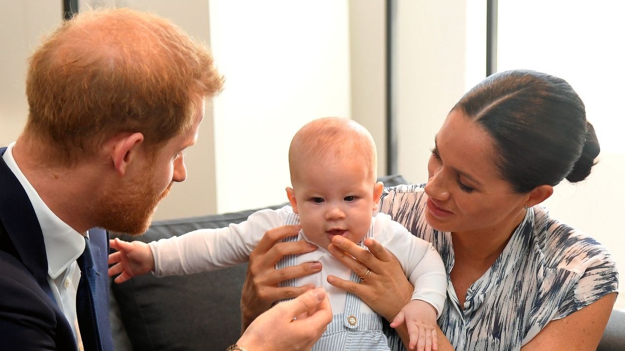 CAPE TOWN, SOUTH AFRICA - SEPTEMBER 25: Prince Harry, Duke of Sussex and Meghan, Duchess of Sussex tend to their baby son Archie Mountbatten-Windsor at a meeting with Archbishop Desmond Tutu at the Desmond &amp; Leah Tutu Legacy Foundation during their royal tour of South Africa on September 25, 2019 in Cape Town, South Africa. (Photo by Toby Melville - Pool/Getty Images)