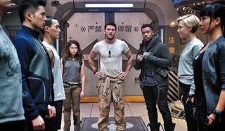 Pacific Rim Uprising Cailee Spaeny Scott Eastwood John Boyega standing in front of the young recruit