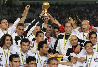 Egypt players and staff celebrate after beating Ivory Coast on penalties to win the Afrcia Cup of Nations in Cairo in February 2006.