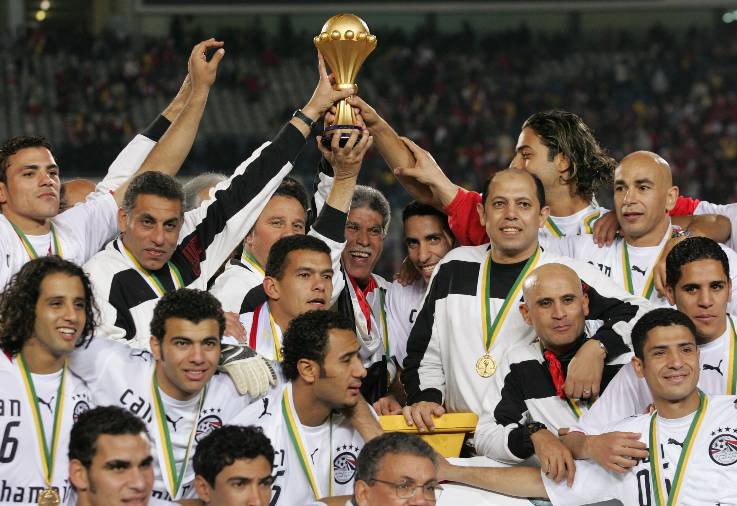 Egypt players and staff celebrate after beating Ivory Coast on penalties to win the Afrcia Cup of Nations in Cairo in February 2006.