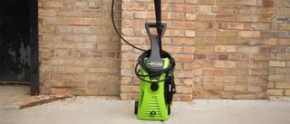 The Harbor Freight Portland 1750 PSI pressure washer unit photographed against a brick wall