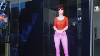A virtual avatar of a woman standing in a red shirt and pink pants looks eerily human, thanks to HYPERVSN SmartV.