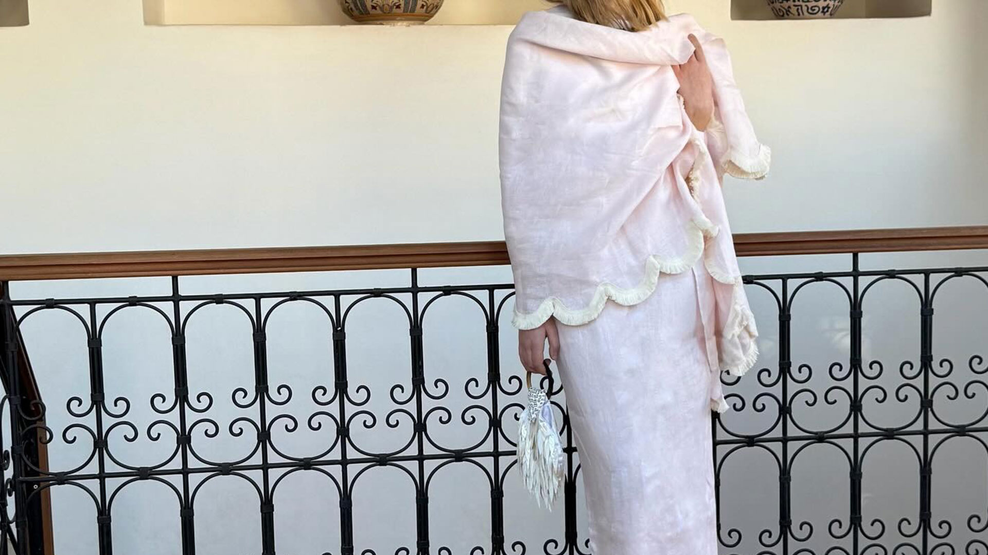 @silviadusci posing in pale pink posse brand fringed wrap matching skirt