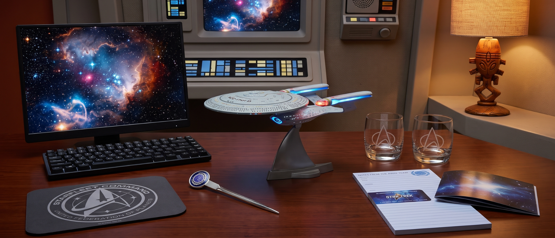 A selection of Star Trek themed home office gear and gadgets on a desk aboard the original Enterprise