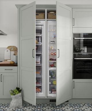 Grey fridge, tile floor