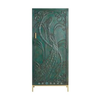Teal armoire with peacock design engraved in