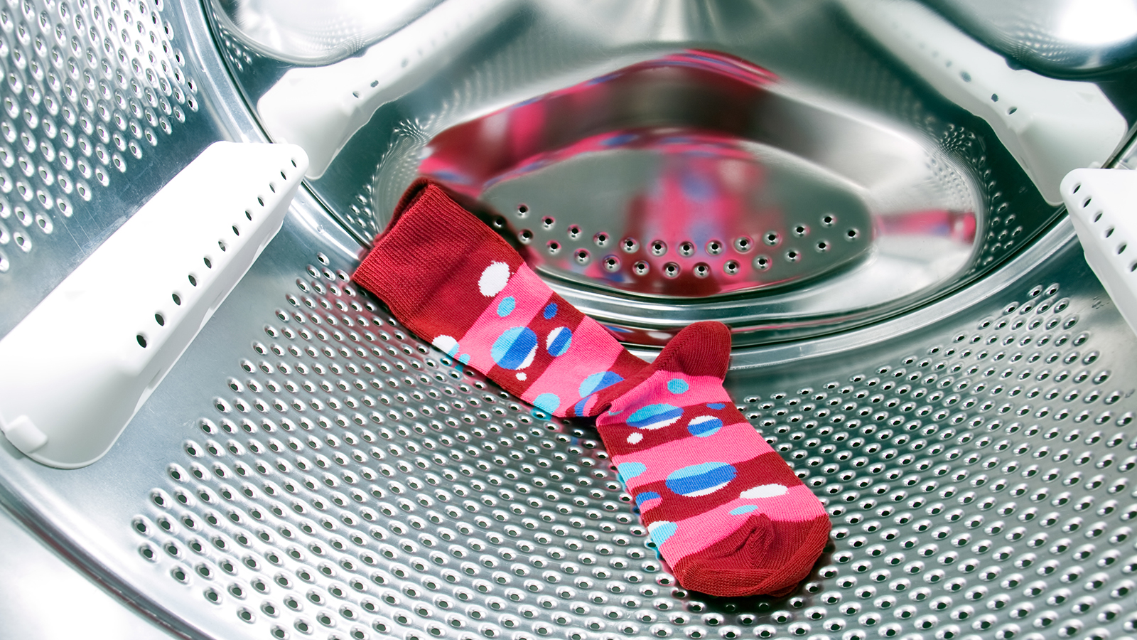 A sock inside a washing machine 