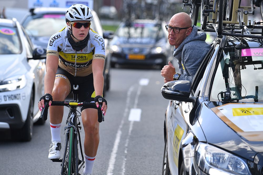 A rider talks with the team mechanic