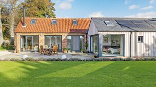 barn conversion with extension with slate roof and clay pantile roof