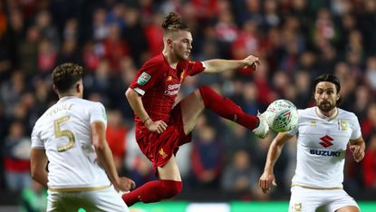 Harvey Elliott, 16, made Liverpool history by starting in the Carabao Cup win at MK Dons 