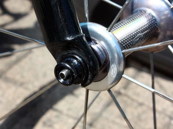 Notice the black anodising and especially fine thread pitch on the skewer shaft? That's because it's aluminum, not titanium or steel.