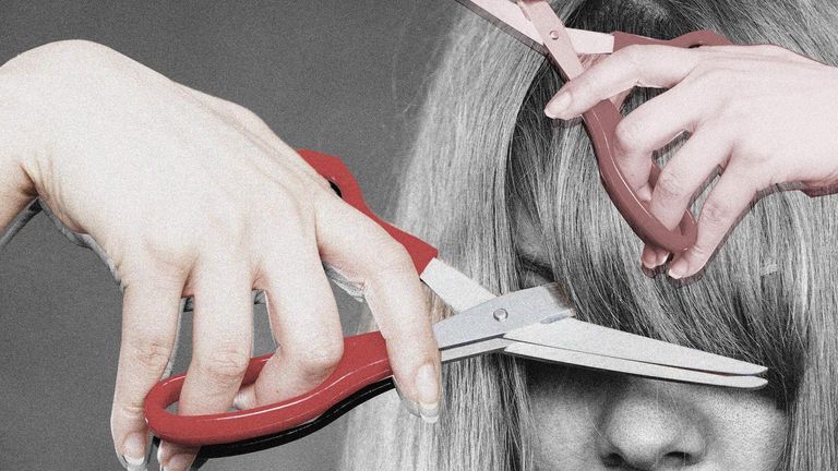 woman cutting her own bangs