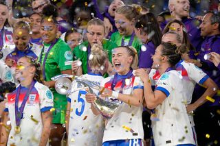 Chloe Kelly forward of England and Arsenal FC lifts the trophy after winning with her team the the UEFA Women's EURO 2025 Final match between England and Spain at St. Jakob-Park on July 27, 2025 in Basel, Switzerland.