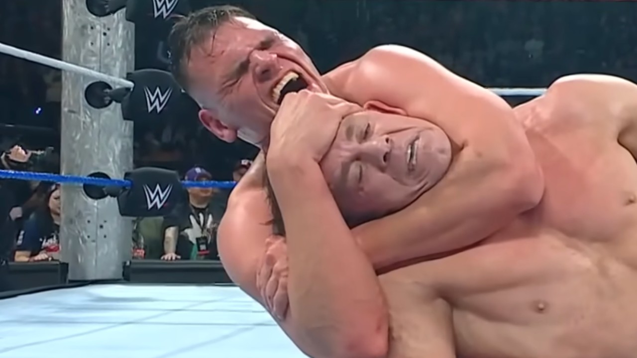 Gunther locks John Cena in the rear naked choke during his final match