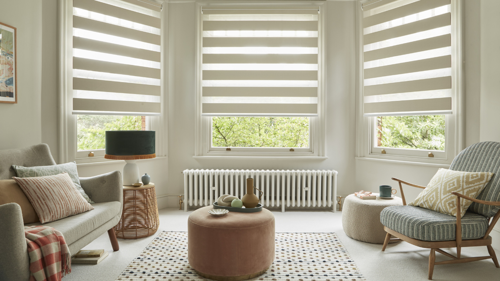 living room with white radiator in large bay window