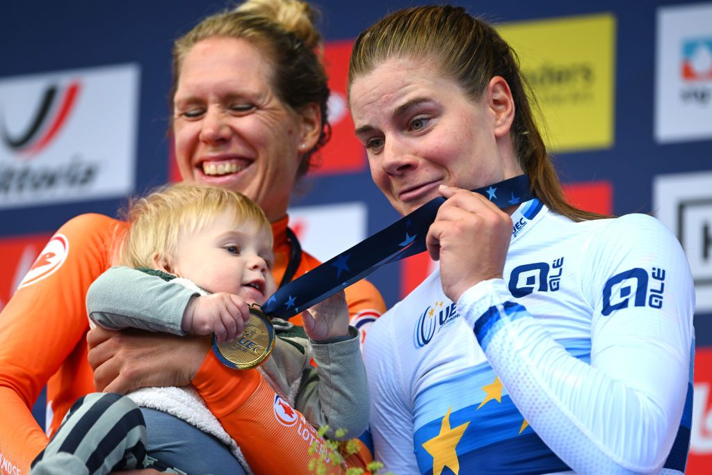 HASSELT BELGIUM SEPTEMBER 11 LR Silver medalist Ellen Van Dijk of Team The Netherlands with her son and gold medalist Lotte Kopecky of Team Belgium pose on the podium during the medal ceremony after the 30th UEC Road Cycling European Championships 2024 Womens Elite Individual Time Trial a 313km from HeusdenZolder to Hasselt UCIWWT on September 11 2024 in Hasselt Belgium Photo by Luc ClaessenGetty Images