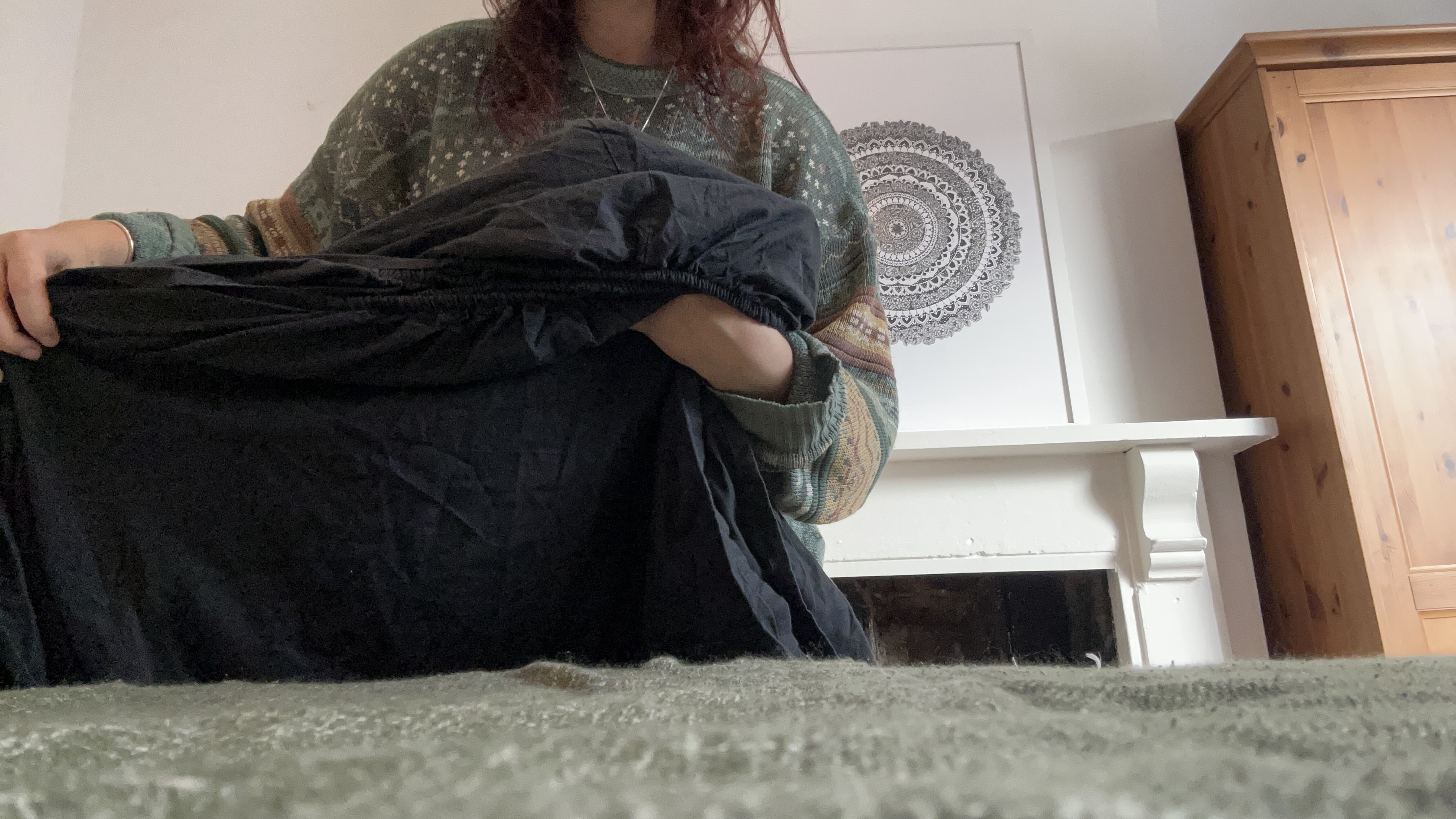 Tom's Guide Sleep Features Editor folding all the corners of a fitted sheet together