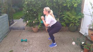 Writer Stacey Carter performs a squat in her back yard