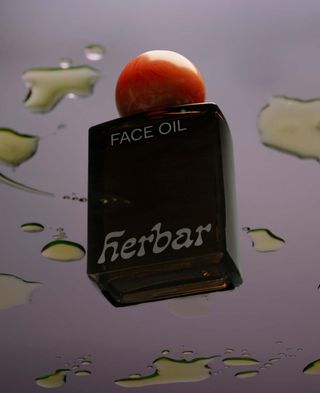 Bottle of Herbar face oil, which uses adaptogens in skincare