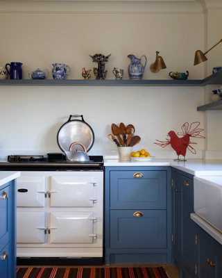 blue country style kitchen with aga
