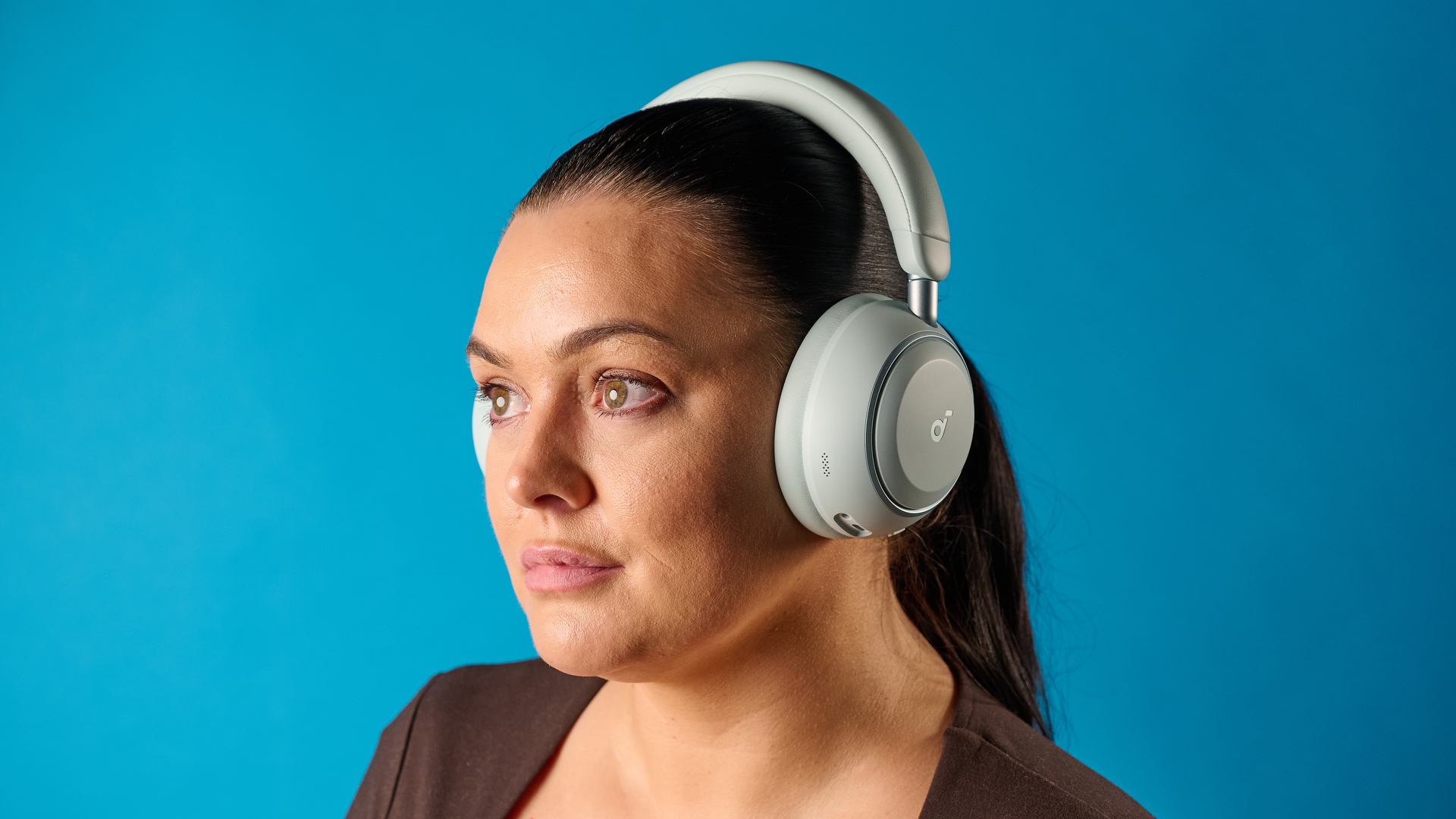 the soundcore space 2 headphones in white photographed against a blue tom's guide background