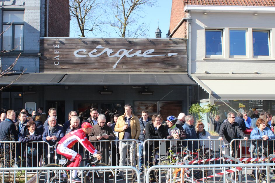 The fans line up outside the cafes to get a glimpse of the riders