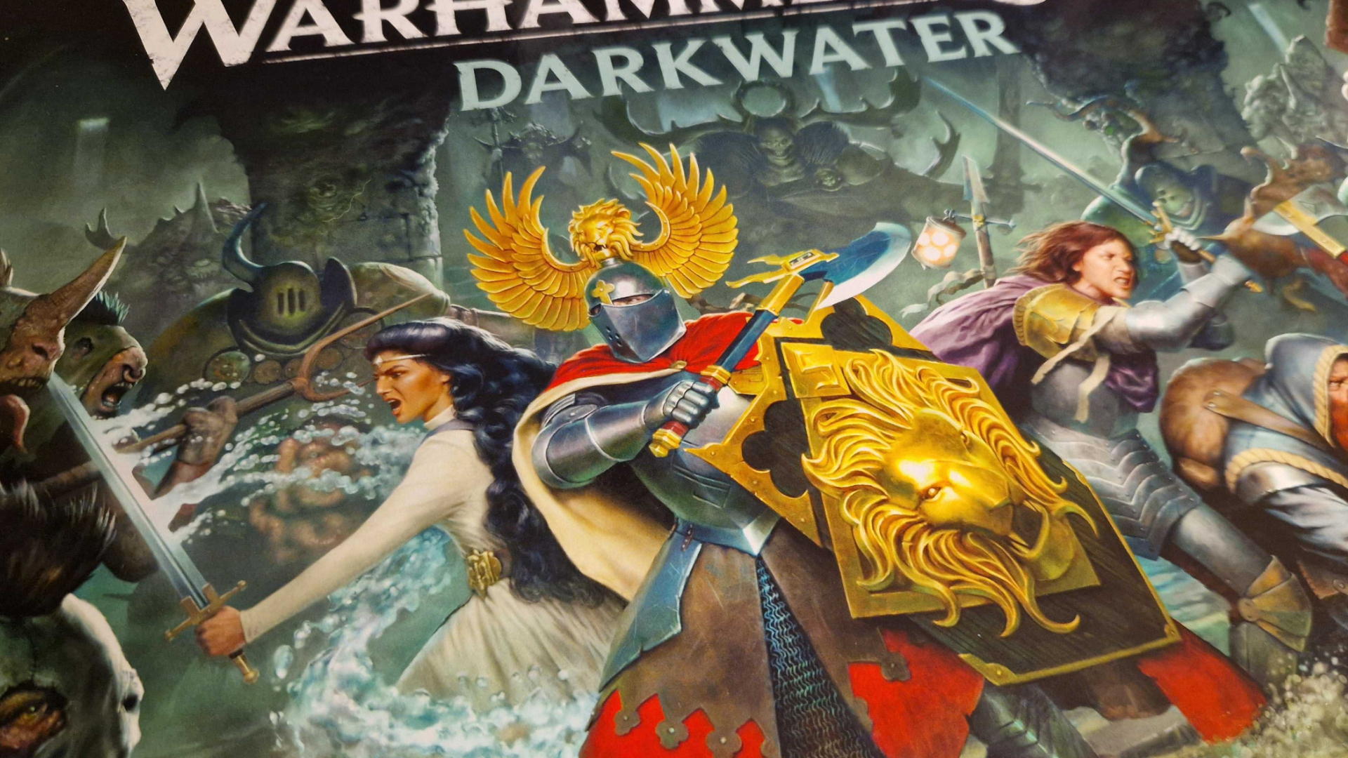 The heroes of Warhammer Quest: Darkwater fighting against monsters in an underground dungeon