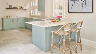 pale green kitchen with small island