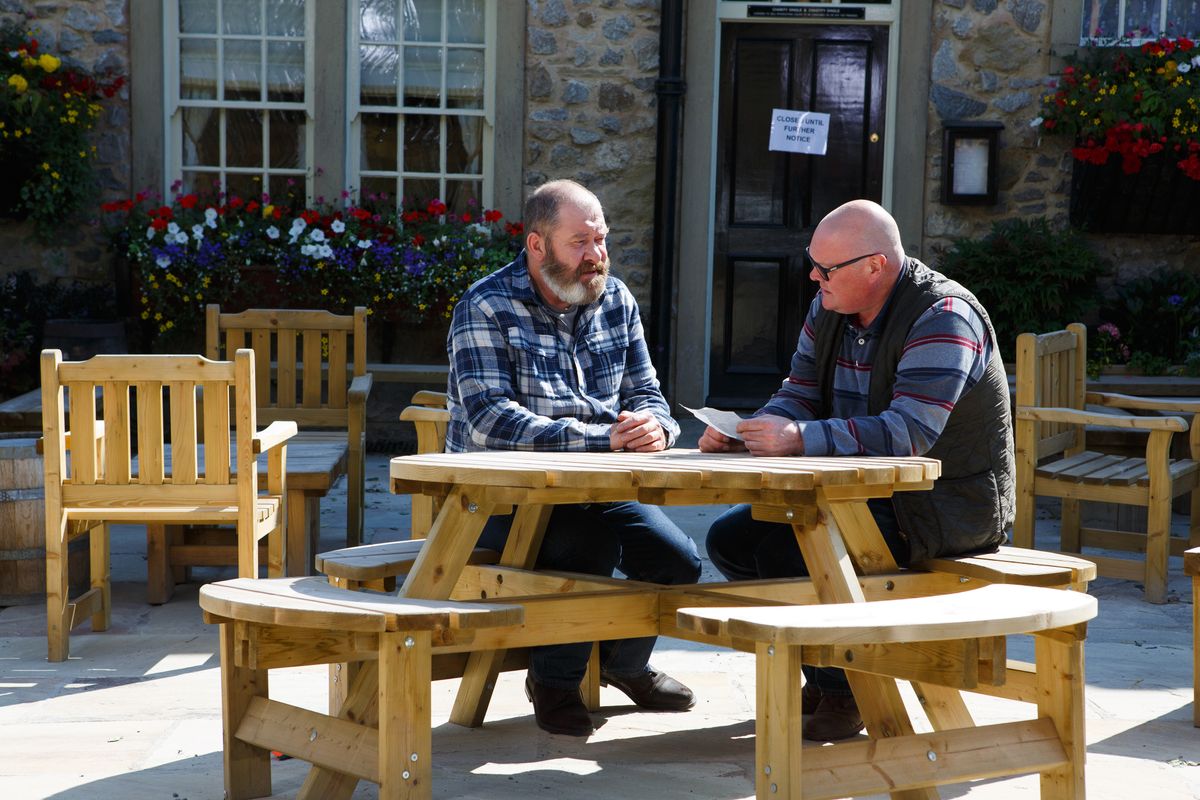 Paddy reads a letter aloud to Bear from his mother in Emmerdale