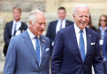 King Charles III and President Joe Biden walk side by side
