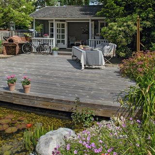 open deck area with plants and wooden flooring