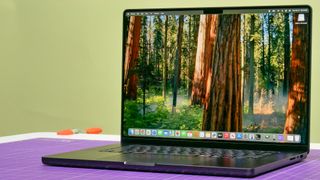 MacBook Pro 14-inch (2024, M4) shown open on a table