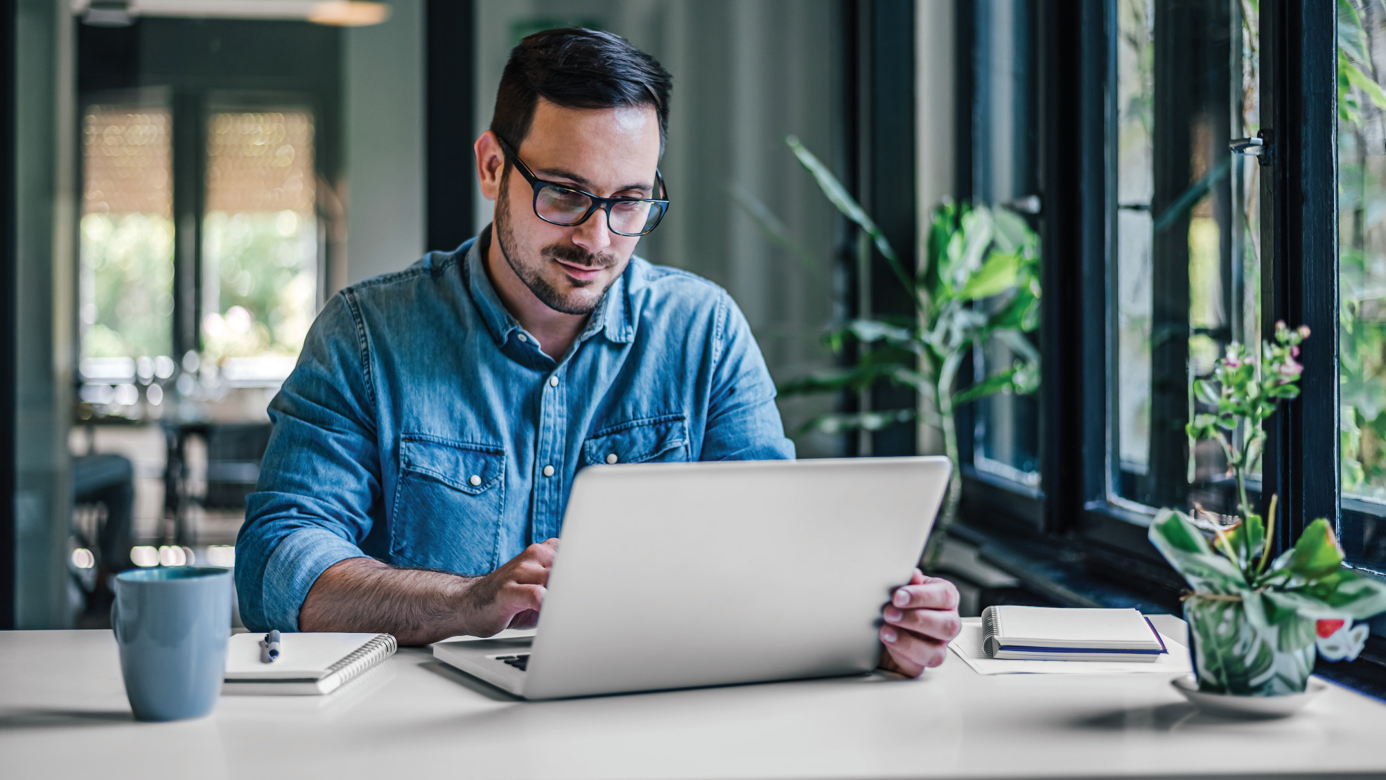 Person using a laptop on a desk