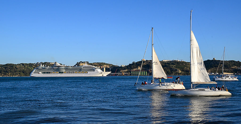 Brilliance of the Seas, a 90,090 GT Radiance-class cruise ship operated by Royal Caribbean International, sails the Tagus River after departure from the cruise terminal on August 26, 2025, in Lisbon, Portugal.