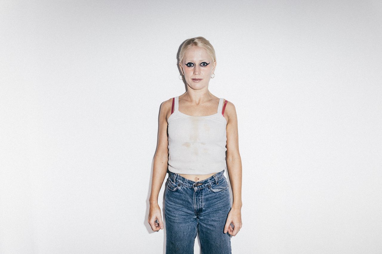 Portraits of Amyl And The Sniffers band members against a white background