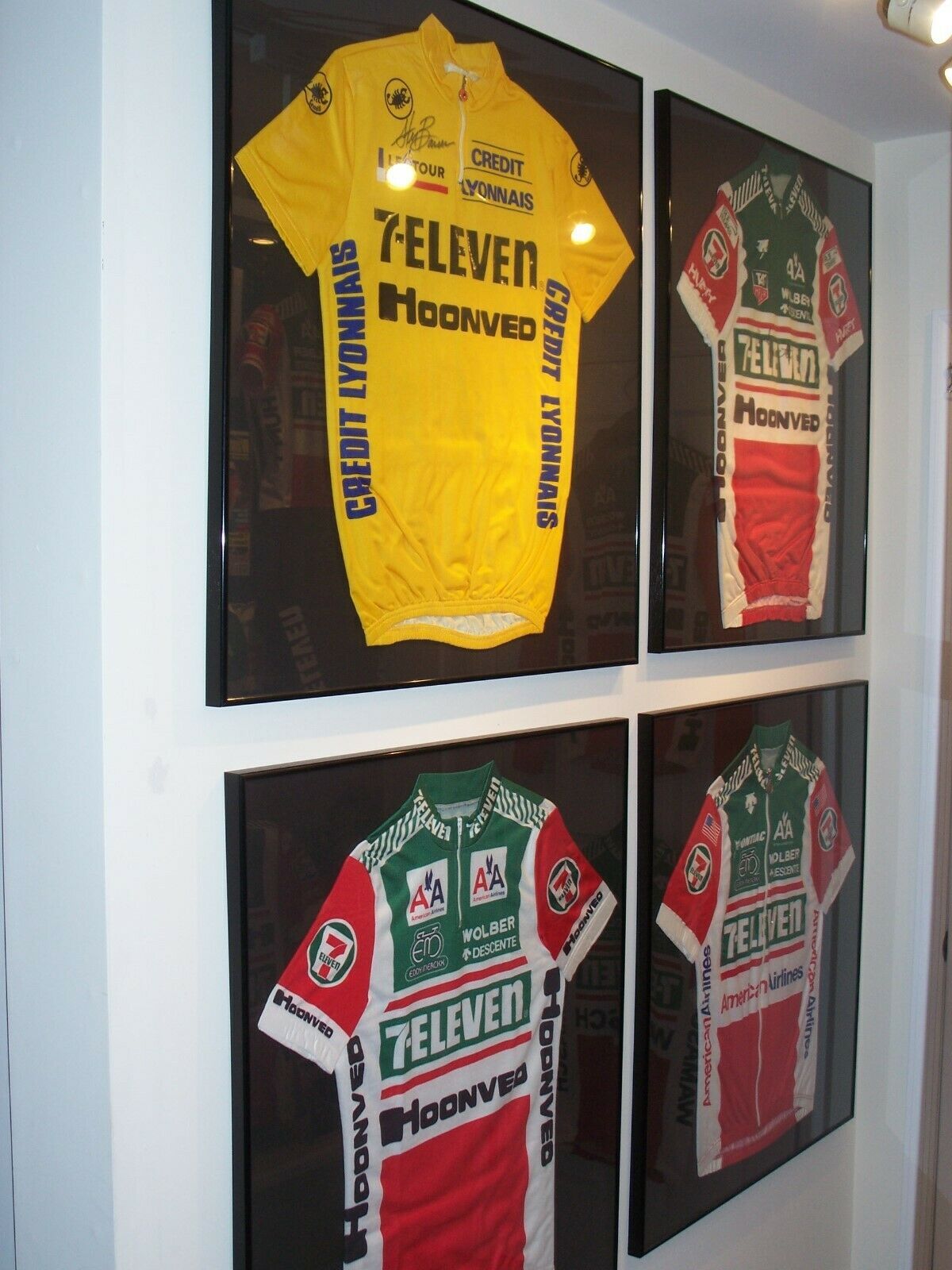 Andy Hampsten&rsquo;s signed jersey, with two other 7-Eleven team jerseys, and Steve Bauer&rsquo;s 1990 Tour de France yellow jersey