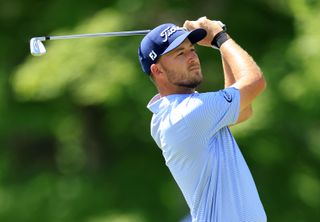 Lee Hodges hits an iron shot from the fairway