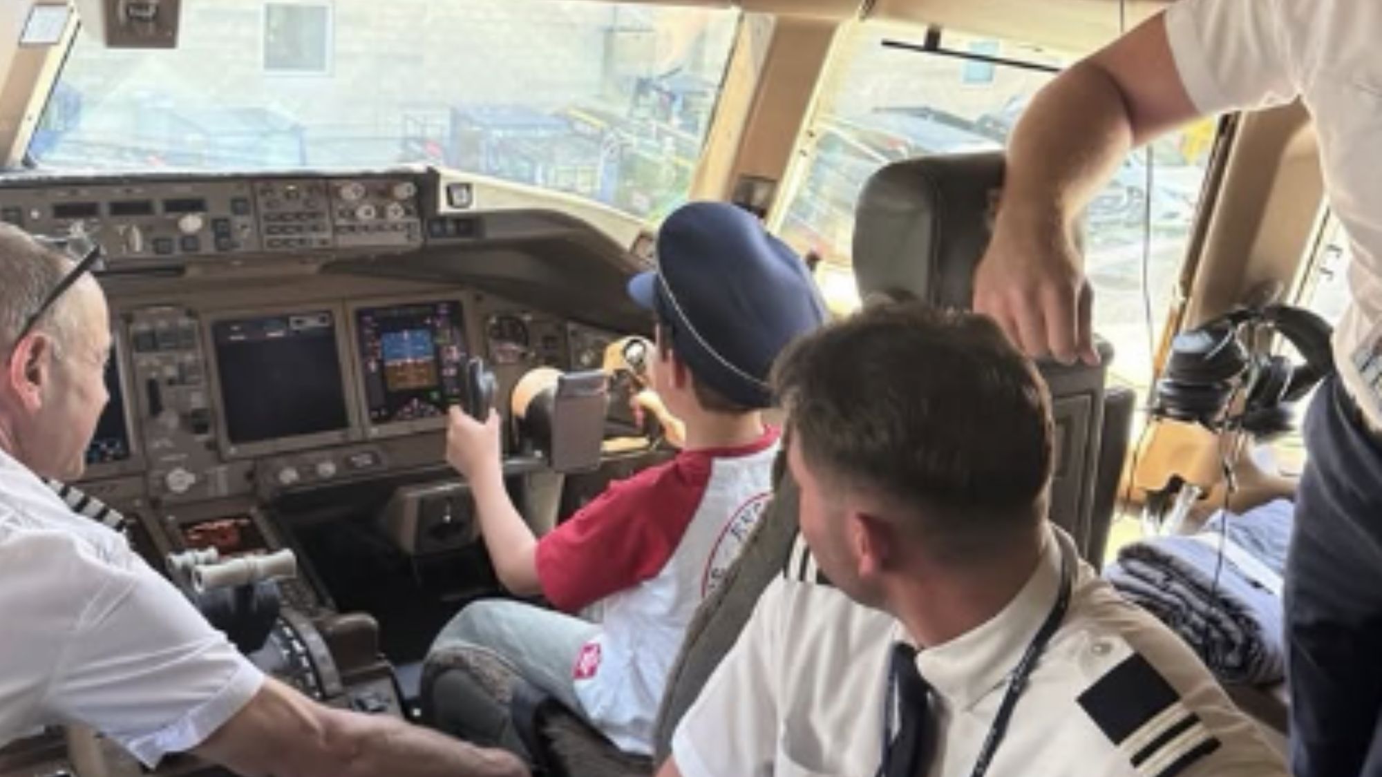 A screenshot from Meghan Markle's Instagram post, showing Archie in the cockpit of an aircraft