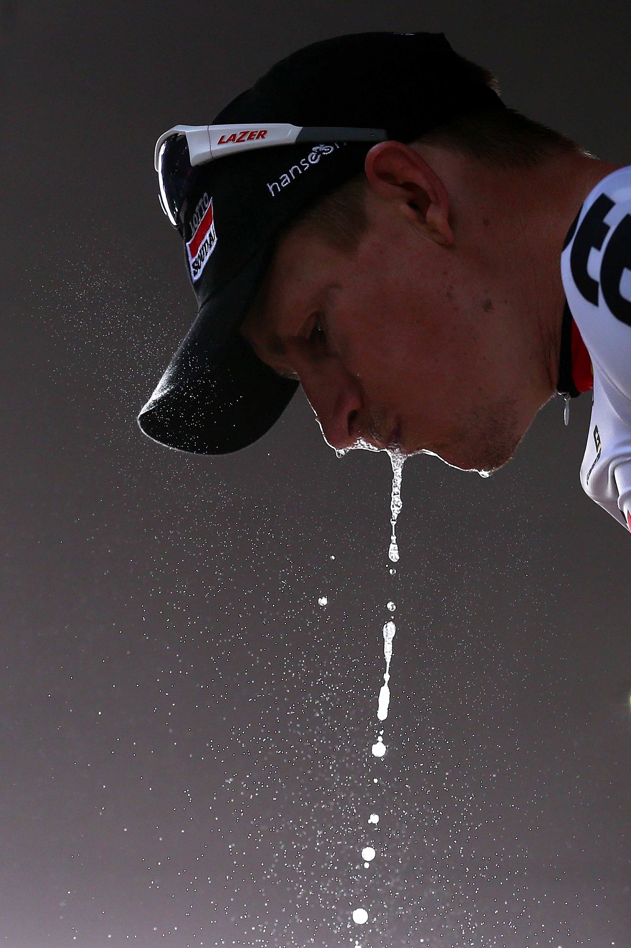 Andr&eacute; Greipel (Lotto Soudal) lets the prosecco drip from his mouth