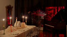 A dining area decorated for Halloween with black sheer curtains partly revealing a red-lit trees outdoors, a grand piano, and a table set with a swan statue in the center among taper candles