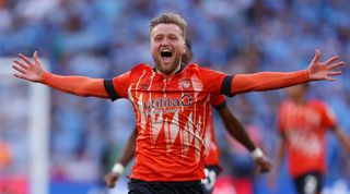 Luke Berry of Luton Town celebrates after Fankaty Dabo of Coventry City (not pictured) misses a penalty in the penalty shoot out which results in a promotion to the Premier League for Luton Town in the Sky Bet Championship Play-Off Final between Coventry City and Luton Town at Wembley Stadium on May 27, 2023 in London, England. (Photo by Richard Heathcote/Getty Images)
