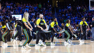 Dallas Wings performers and dancers on court