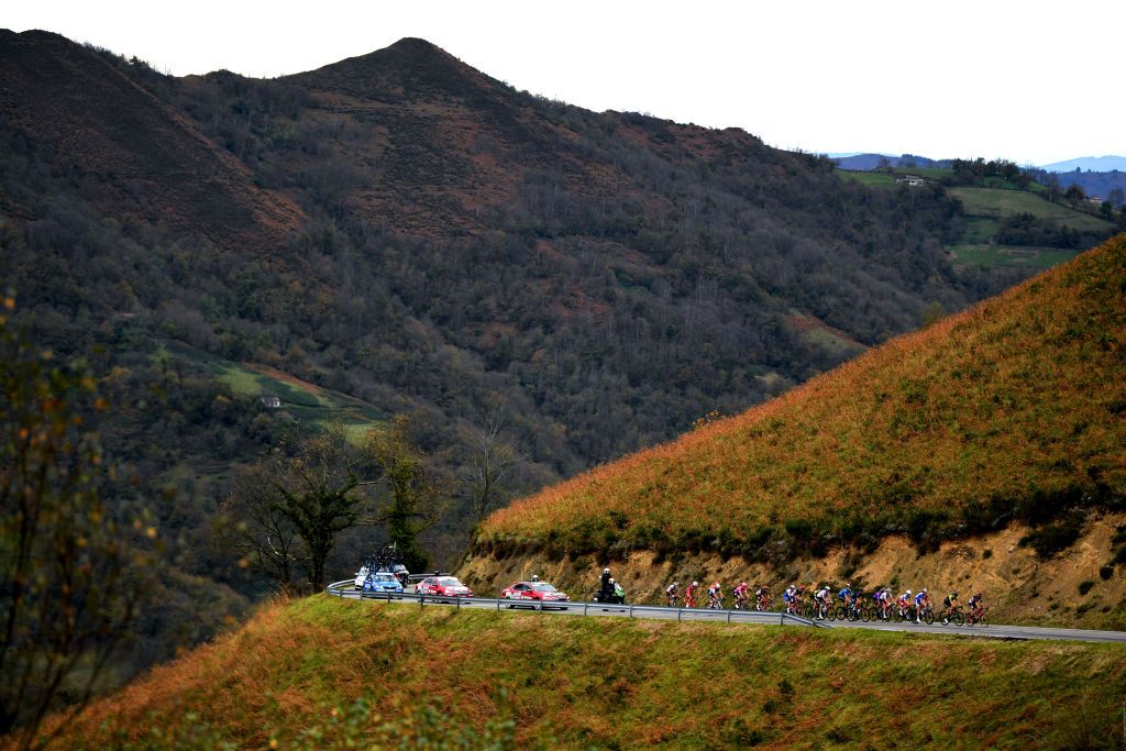 ALTODELANGLIRU SPAIN NOVEMBER 01 Mattia Cattaneo of Italy and Team Deceuninck QuickStep Aliaksandr Riabushenko of Belarus and UAE Team Emirates Luis Leon Sanchez Gil of Spain and Astana Pro Team Andreas Schillinger of Germany and Team BORA Hansgrohe Cameron Wurf of Australia and Team INEOS Grenadiers Robert Stannard of Australia and Team Mitchelton Scott Alexander Edmondson of Australia and Team Mitchelton Scott Anthony Roux of France and Team Groupama FDJ Julius Van Den Berg of The Netherlands and Team EF Pro Cycling Nans Peters of France and Team AG2R La Mondiale Lukasz Wisniowski of Poland and CCC Team Kobe Goossens of Belgium and Team Lotto Soudal Tosh Van Der Sande of Belgium and Team Lotto Soudal Guillaume Martin of France and Team Cofidis Solutions Credits Polka Dot Mountain Jersey PierreLuc Perichon of France and Team Cofidis Solutions Credits Enrico Gasparotto of Switzerland and NTT Pro Cycling Team Imanol Erviti of Spain and Movistar Team Jhojan Orlando Garcia Sosa of Colombia and Team Caja RuralSeguros RGA Angel Madrazo of Spain and Team Burgos BH Breakaway Alto de la Mozqueta 845m Mountains Autumn Landscape during the 75th Tour of Spain 2020 Stage 12 a 1094km stage from Pola de Laviana to Alto de lAngliru 1560m lavuelta LaVuelta20 La Vuelta on November 01 2020 in Alto de lAngliru Spain Photo by David RamosGetty Images