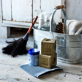 steel bucket with cleaning liquid cloth broom and brush