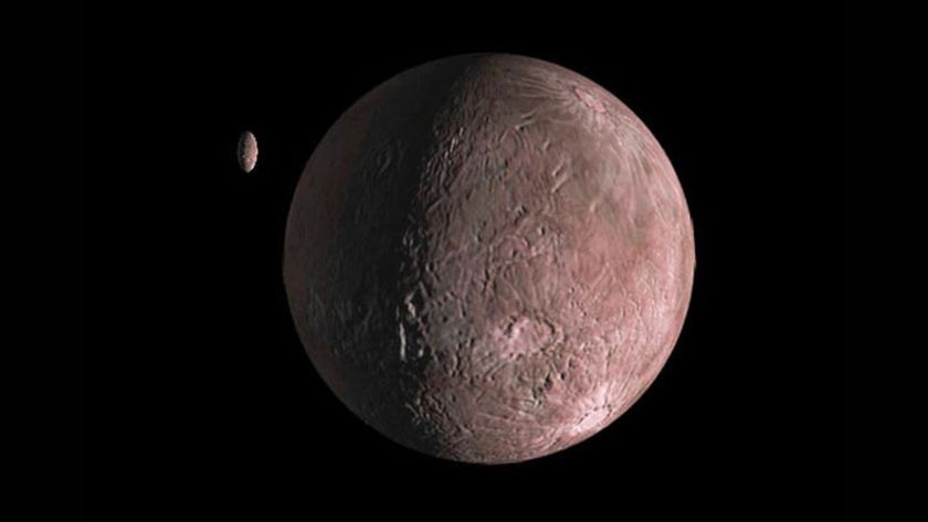 A small reddish rocky planet is seen in the darkness of space with a smaller planet-looking object nearby