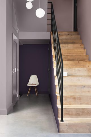 Hallway colour idea with grey and purple paint and wooden staircase