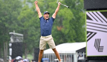 Bryson DeChambeau jumps on the air whilst celebrating his putt