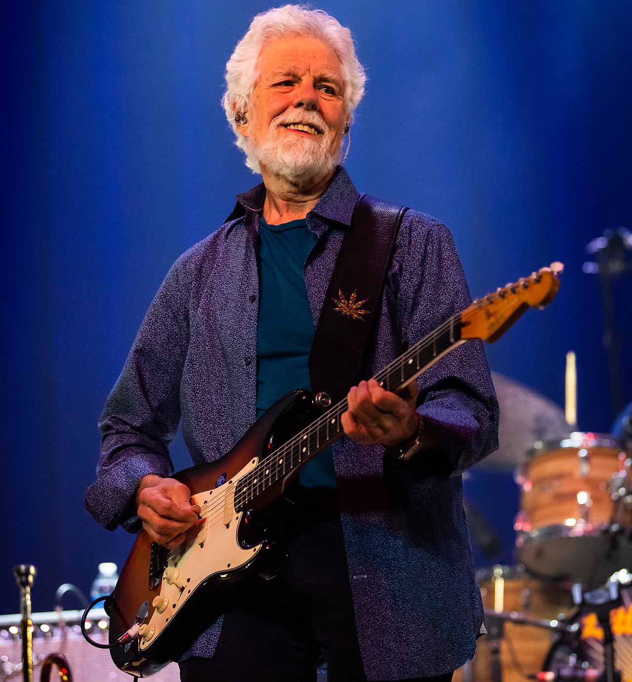 Fred Tackett performs onstage